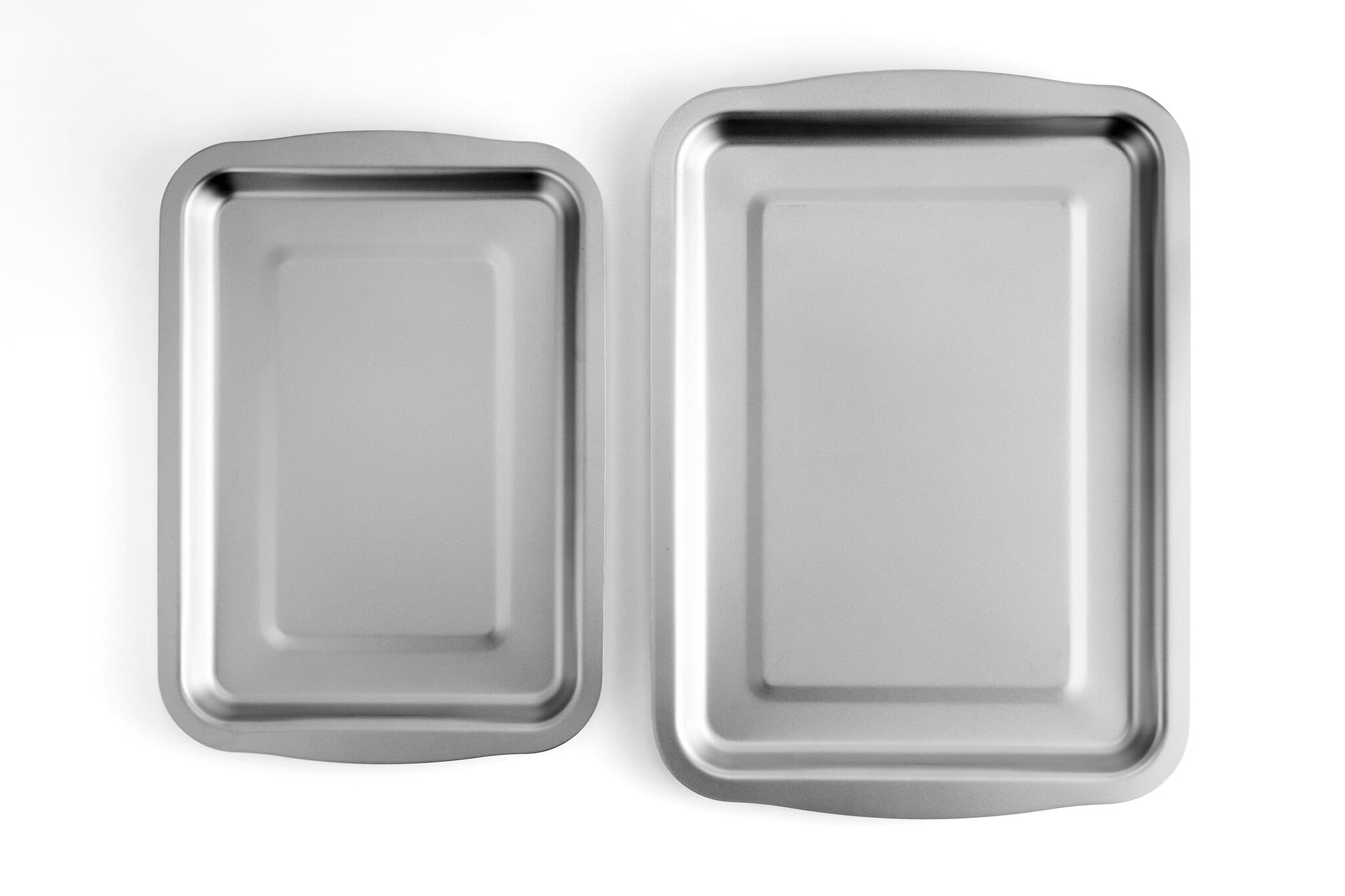 Two stainless steel baking trays of different sizes for professional kitchen use.
