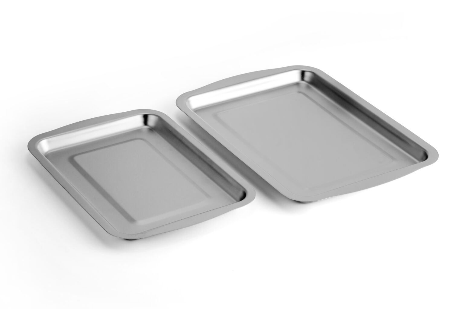 Stainless Steel Baking Trays Set Two stainless steel baking trays of different sizes for professional kitchen use.