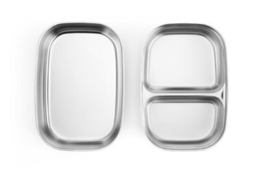 Stainless steel bento box with two compartments for food storage.