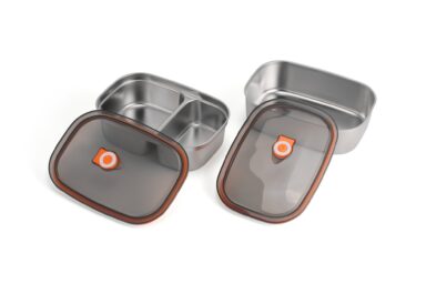 Stainless steel food storage containers with airtight lids for kitchen organization.