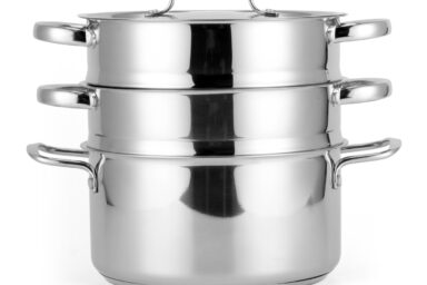 High-quality stainless steel steamer pot with three tiers and lid, ideal for healthy cooking.