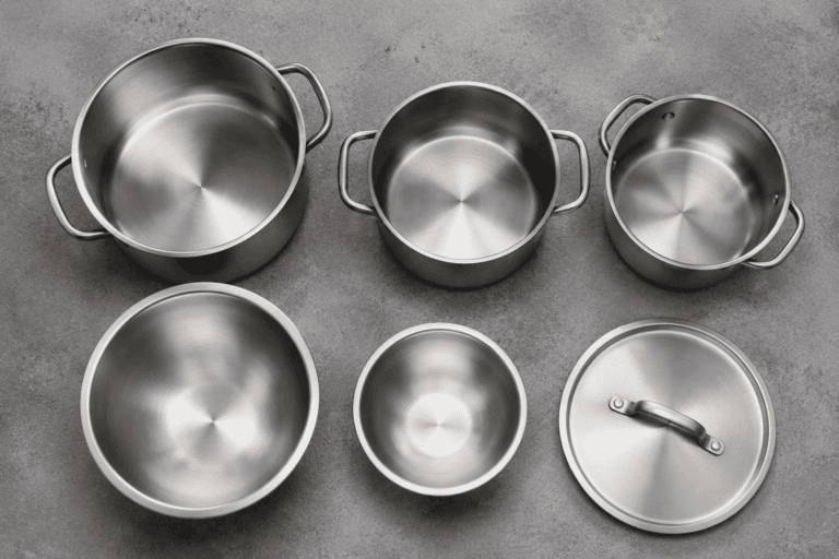 High-quality stainless steel cookware with lids and handles for professional kitchens.